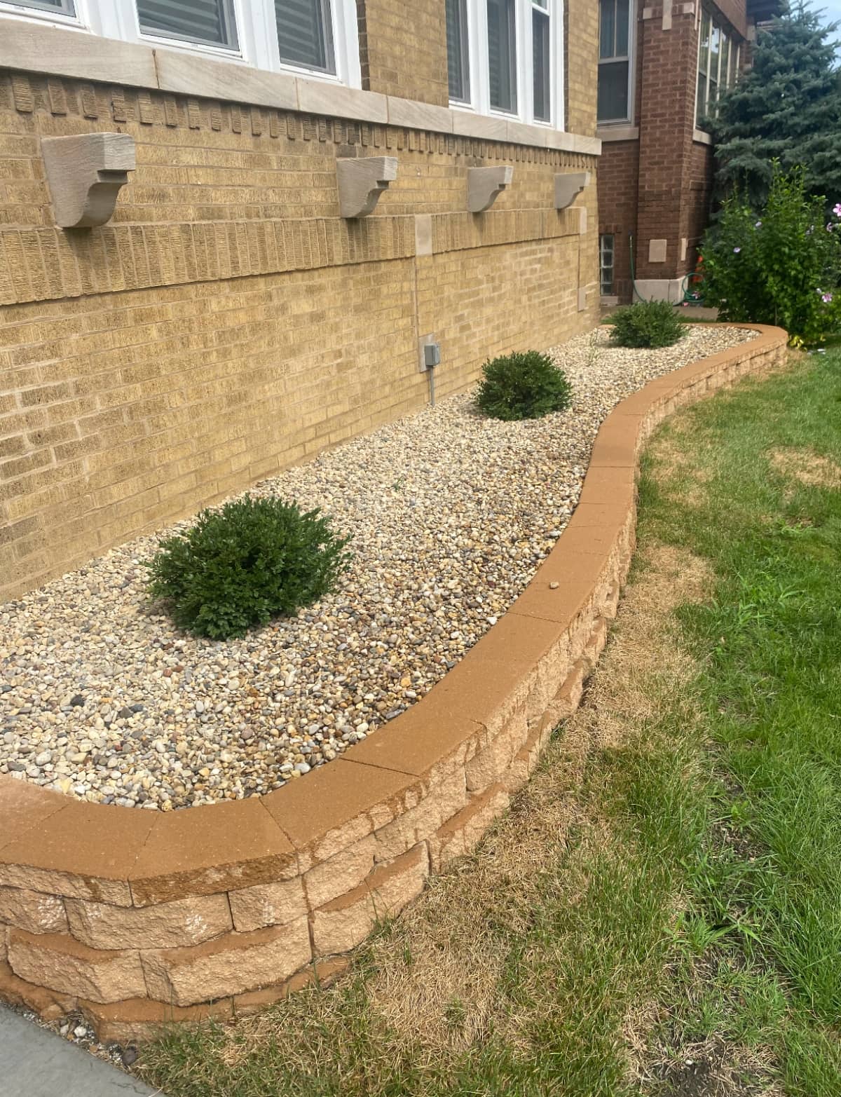 Brown retaining wall with gravel