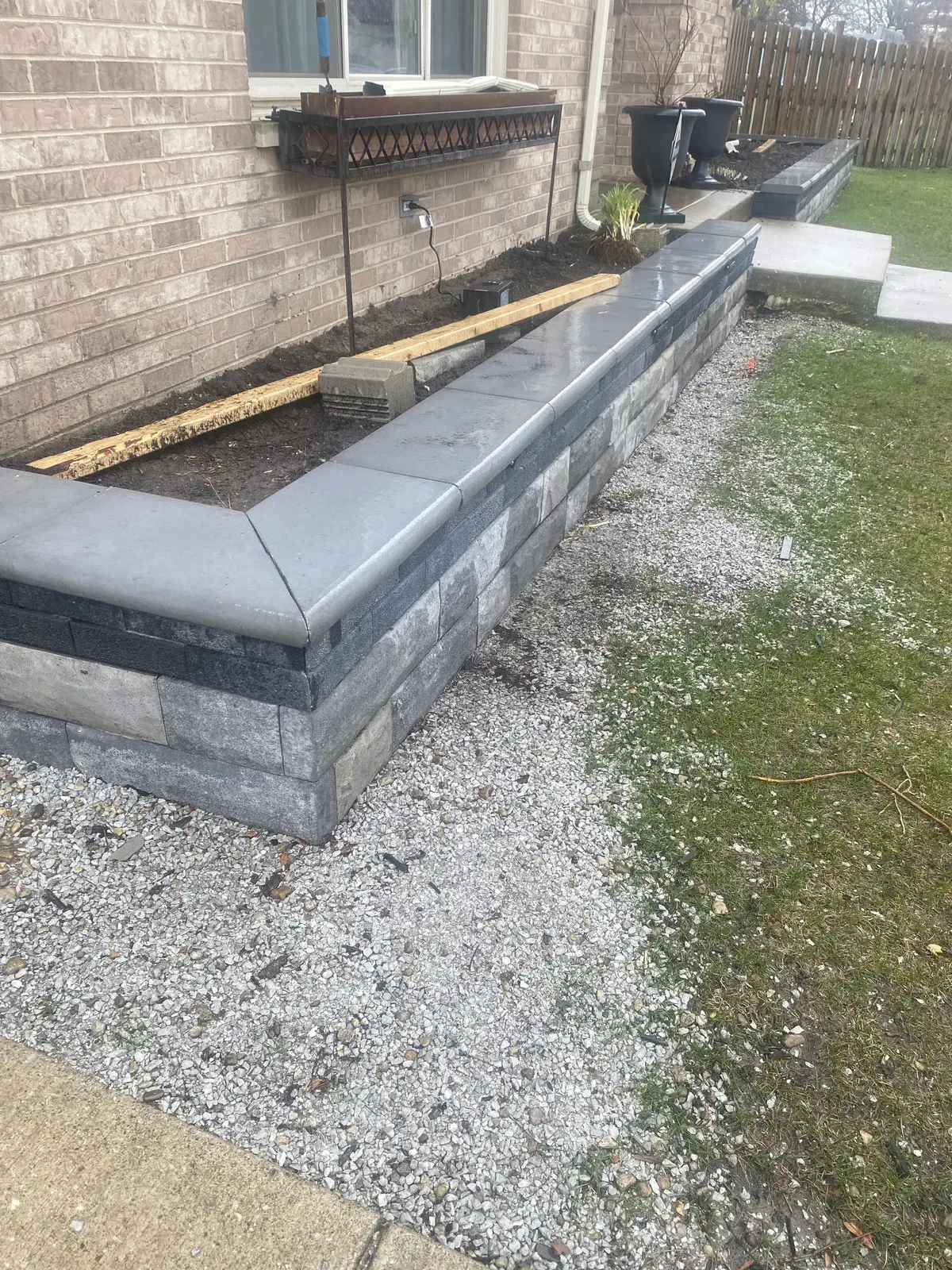 High standing retaining wall with three layers of stone